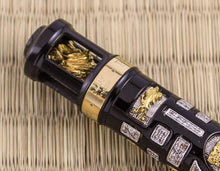 Load image into Gallery viewer, Close up to the engraved edition number of the fountain pen on the gold vermeil ring.