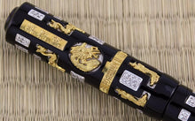 Load image into Gallery viewer, Close up to the dragon medal within the cap.