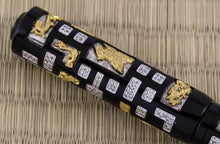 Load image into Gallery viewer, Close up to the side of the cap showing the gold vermeil pieces, silver pieces, and diamonds. There are golden designs