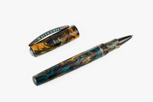 Load image into Gallery viewer, Angled view of the Visconti Earth Origins Rollerball Pen on a white background. The pen and cap are made of blue, yellow and dark brown swirls of lacquer, and feature metal trims.