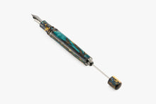 Load image into Gallery viewer, The Visconti Homo Sapiens Earth Origins Fountain Pen without the cap, and with the piston pulled.