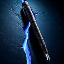 Load image into Gallery viewer, Decorative pen with glowing blue energy effect on a dark textured background.