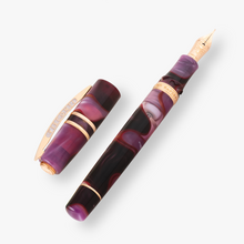 Load image into Gallery viewer, Visconti Homosapiens Iris Garden Fountain Pen with the cap set to the side.