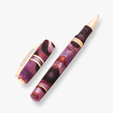 Load image into Gallery viewer, Visconti Homosapiens Iris Garden Pen Rollerball with the Cap set to the side.