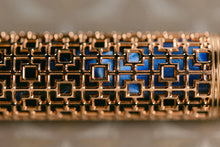 Load image into Gallery viewer, Close up to the gold overlay of the Visconti Looking East Fountain Pen.