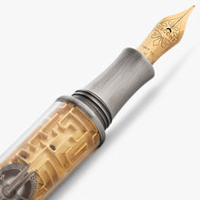 Load image into Gallery viewer, Fountain pen with gold nib and decorative body on a white background.