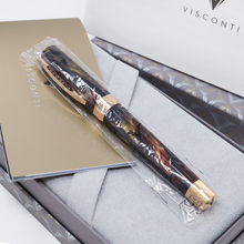 Load image into Gallery viewer, Angled view of the Fountain Pen arranged in the included plastic sleeve with the presentation box and documents.