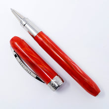 Load image into Gallery viewer, Front view of the Visconti Rembrandt rollerball pen with the cap set next to it. The body is made of red acrylic resin with some slight swirls of white and darker red on it. The trims are made of palladium plated polished brass.