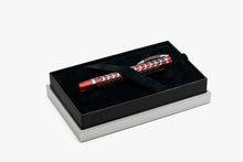 Load image into Gallery viewer, The Visconti Skeleton Ruby Red Fountain Pen in its presentation box under the felt strap.