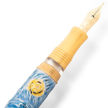 Load image into Gallery viewer, Close up to the fountain pen nib. It has an elaborate decoration engraved with the words VISCONTI, 18KT 750, F