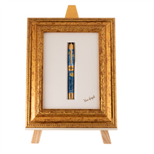 Load image into Gallery viewer, Front view of the Pen in the included slot of the display easel and framed canvas.