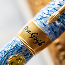 Load image into Gallery viewer, Close up to the ring cap. It has an engraving that says "Van Gogh" and is filled in black.