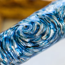 Load image into Gallery viewer, Close up to the brush stroke design on the pen's body. It is blue and silver.