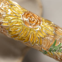 Load image into Gallery viewer, Close up to a sunflower on the pen. Set on a blurry background.