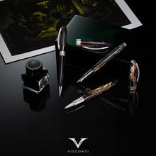 Load image into Gallery viewer, The Rollerball, Fountain Pen, ink bottle, and ballpoint pen are arranged with the Potato Eaters print on a black background.