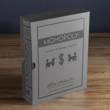 Load image into Gallery viewer, Angled front view of the Monopoly book-shaped packaging.