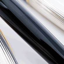 Load image into Gallery viewer, Close up to the black lacquer of the ballpoint pen. It shows brush marks.