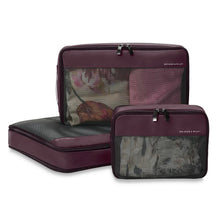 Load image into Gallery viewer, Briggs & Riley Check-In Packing Cube Set - Plum
Briggs & Riley Check-In Packing Cube Set shown in Plum and shown packed with clothing. Large on Bottom and Medium and small shown in vertical postion.
Small cube: 8.5 x 6.5 x 3 in / 21.6 x 16.5 x 7.6 cm
Medium cube: 13 x 8.5 x 3 in / 33 x 21.6 x 7.6 cm
Large cube: 17 x 13 x 3 in / 43.2 x 21.6 x 7.6 cm