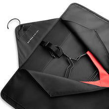 Load image into Gallery viewer, Briggs & Riley Check-In Garment Sleeve - Black
Interior View shows the integrated closure hook which doubles as hangable feature to hang and organize your items with ease.
Dimensions:  16.5 x 13 in / 41.9 x 33 cm
