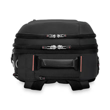 Load image into Gallery viewer, Top panel view of the black duffle backpack. It features a grip handle, and a zipper closing pocket behind it.