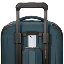 Load image into Gallery viewer, Briggs & Riley ZDX 22" Domestic Carry-On Expandable Spinner - Ocean Blue
Image of Back Panel with Retractable ID Tag shown pulled up for identification
Dimensions:  22 x 14 x 9"
Weight:           7.4 lbs.