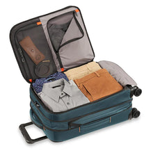 Load image into Gallery viewer, Briggs & Riley ZDX 22" Domestic Carry-On Expandable Spinner - Ocean Blue
Image of Main Compartment shown packed in fully expanded position.  Also showing two accessory packing compartments in upper lid of suitcase.
Dimensions:  22 x 14 x 9"
Weight:           7.4 lbs.
