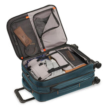 Load image into Gallery viewer, Briggs & Riley ZDX 22" Domestic Carry-On Expandable Spinner - Ocean Blue
Image of Main Compartment fully packed and shown with garment panels engaged to prevent articles of clothing from shifting in transit.
Dimensions:  22 x 14 x 9"
Weight:           7.4 lbs.