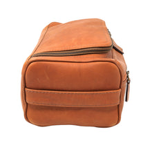 Load image into Gallery viewer, side view of a tan leather toiletry bag with a horizontal strap detail