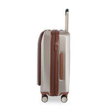 Load image into Gallery viewer, Side panel view of the beige suitcase. It features a grab handle.