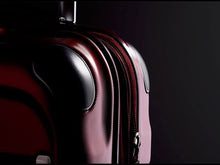 Load and play video in Gallery viewer, Angled close ups to the red Ricardo suitcase shown in use with text: Where Luxury Meets Performance.