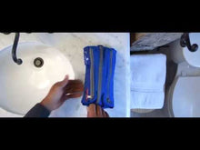 Load and play video in Gallery viewer, A variation of shots demonstrating different people in different backgrounds folding clothes and organizing their belongings into different packing cubes by Eagle Creek.