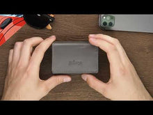 Load and play video in Gallery viewer, Video showing the card and cash compartments of the wallet.
