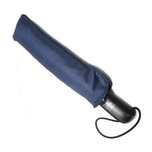Load image into Gallery viewer, Angled view of the blue umbrella in its sleeve on a white background. The handle is black, and it has a thin black strap.