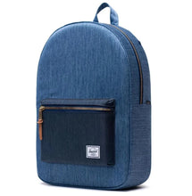 Load image into Gallery viewer, Angled front view of the faded denim backpack.