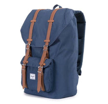 Load image into Gallery viewer, Angled front panel view of the navy blue backpack.