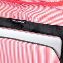 Load image into Gallery viewer, Close up to the a laptop store din the back panel's padded compartment.