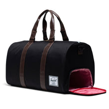 Load image into Gallery viewer, Angled view of the Black Chicory Coffee Duffle bag. The Side panel shoe compartment is unzipped.