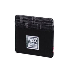 Load image into Gallery viewer, Angled view of the black and grayscale plaid wallet.