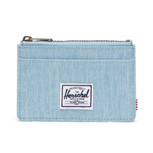 Load image into Gallery viewer, Light Denim Herschel RFID Oscar Wallet with a zippered main compartment and external card slots.