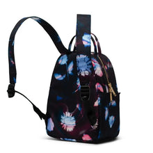 Load image into Gallery viewer, Angled back panel view of the Sunlight Floral backpack with the shoulder straps pulled up.