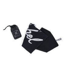 Load image into Gallery viewer, The folded black camp towel and matching storage pouch on a white background.