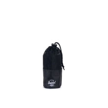 Load image into Gallery viewer, The black camp towel rolled and stored inside the pouch.
