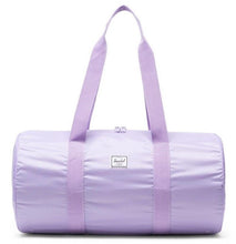 Load image into Gallery viewer, Front view of the Lavendula packable duffle bag with the shoulder straps pulled up.