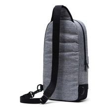 Load image into Gallery viewer, Angled back panel view of the backpack with the shoulder strap's clip attached to the left loop.