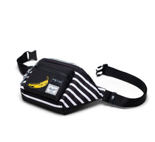 Load image into Gallery viewer, The Andy Warhol Banana hip pack laid on the back panel. The adjustable straps are detached.