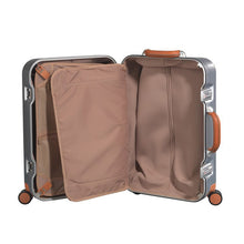 Load image into Gallery viewer, Interior view of the suitcase. It features tan fabric lining, and panel dividers with pockets.