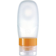 Load image into Gallery viewer, Front view of the transparent travel bottle with orange cap ring.