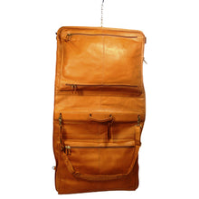 Load image into Gallery viewer, Dorado Colombian Leather Garment Bag - Tan
Image of tan leather garment bag in hanging position, showing top and bottom zippered pockets, leather handle, and matching leather adjustable shoulder strap.
Dimensions: 44"(L) x 23"(W) x 3.5"(D)