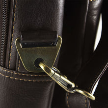 Load image into Gallery viewer, Angled close up to the brass shoulder strap clip.