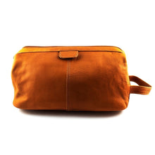 Load image into Gallery viewer, Back view of the tan leather toiletry bag.